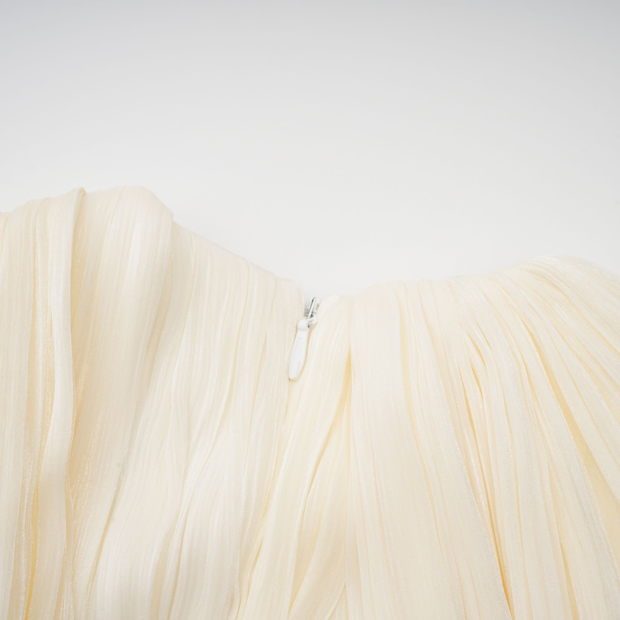Cyrielle Pleated Mini Dress Round Neck Asymmetrical Ribbon Design Detail Neutrals