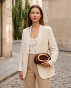 Vanya Sculptural Clutch Bag Rounded Shape Metallic Accent Chain Strap Brown