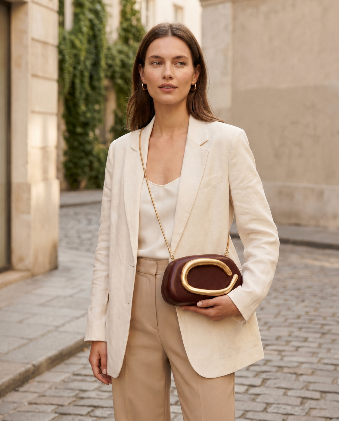 Vanya Sculptural Clutch Bag Rounded Shape Metallic Accent Chain Strap Brown