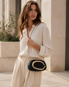 Vanya Sculptural Clutch Bag Rounded Shape Metallic Accent Chain Strap Brown